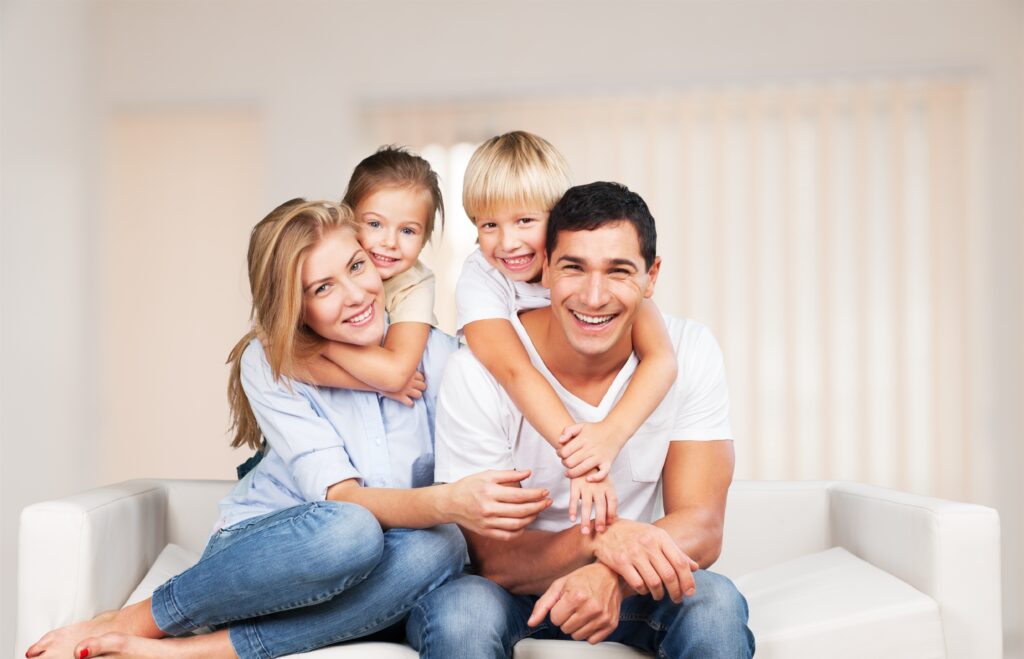 Smiling family representing the results of quality family dentistry in Provo